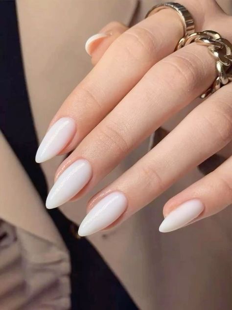 As autumn arrives with its warm hues and cozy vibes, white fall nails stand out as a fresh, stylish choice for the season. Crisp, versatile, and effortlessly chic, white nails blend beautifully with fall colors while adding a unique twist. From elegant whites with glitter accents to trendy ombré effects and matte finishes, white nail designs are perfect for fall. In this guide, we’ll explore creative ideas to elevate your fall manicure, featuring various styles like white marble nails, gold acce Autumn Nails White, Russian Manicure Almond Nails, White Nail Inspo Almond, Almond White Nails Design, Russian Nails Design, White Almond Shaped Nails, Winter Nails Minimalist, White Nude Nails, Russian Manicure Design