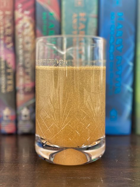 How to Make Felix Felicis (Liquid Luck!) ⋆ Follow the Butterflies Felix Felicis Recipe, Liquid Luck Harry Potter, Harry Potter Liquid Luck, Harry Potter Felix Felicis, Gold Food Coloring, Harry Potter Movie Night, Liquid Luck, Harry Potter Travel, Gold Food