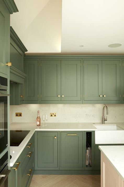 Green kitchen cabinets with white marble worktop in a family home renovation. This family home situated on a popular 1930s street in the heart of Hampstead Garden Suburb has undergone a full renovation and rear extension. The clients chose a cool palette of blues and greens creating a cosy space in the evening. Design: XUL Architecture and Photography by Matt Clayton 1930’s Kitchen, 1930s Home Decor, 1930s House Interior, 1930s Home, Marble Worktop, 1930s Kitchen, White Worktop, Green Kitchen Cabinets, Rear Extension