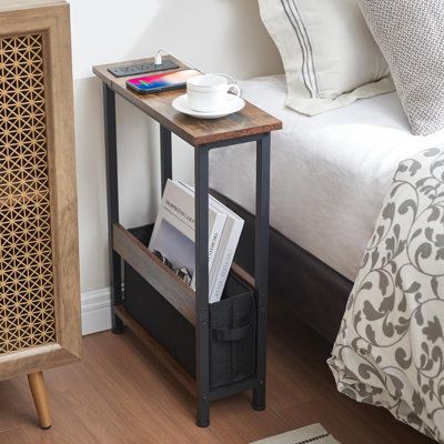 Fit In Narrow Small Spaces: This small side table takes up a small footprint, it is the perfect height and size to fit in the narrow spaces next to your bed, couch, sofa chair, recliner 17 Stories | 17 Stories Gaute Metal Nightstand 24.7 H x 19.0 W x 7.1 D in brown / grayWood / Metal in Black;brown | 24.7" H X 19" W X 7.1" D | Wayfair Narrow Side Table Bedroom, Couch Side Table Ideas, Bedside Table Alternative Small Spaces, Small Apartment Storage Solutions Bedroom, Nightstand Alternative Small Spaces, Narrow Nightstand Ideas, Small Nightstand Ideas, Small Bedside Table Ideas, Slim Nightstand