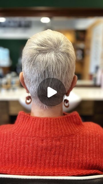 Rene @ HFDZK, Wmn’s Barbershop on Instagram: "José trades her bleached, yellowish mullet for a sleek and stylish grey pixie cut. ✂️👩‍🦳 This isn’t just a haircut, it’s a bold statement of embracing natural beauty and confidence. Get ready to be amazed by her stunning new look and the magic that happens when you dare to go short!#HaircutAdventures #PixieCut #Buzzcut #WomensShortHair #PixieBuzz #ShortHairLove #ChicBuzzcut #TrendyPixie #EdgyShortHair #BuzzcutStyle #PixieChic #ModernPixie #BoldBuzzcut #PixieHair #BuzzcutFashion #ElegantShortHair #StylishPixieCut #BoldShortHair #PixieTransformation #ShortHairTrends #FashionableShortHair #BuzzcutMagic #PixiePerfection #ShortHairstyle #CharmingPixie #CreativeCuts #wahlambassador #pixie" What Products To Use To Style Short Hair, Short Grey Pixie Haircut, Very Short Pixie Haircut For Thick Hair, Pixie Cut Back View Neckline, Edgy Short Hair Pixie, Grey Pixie Haircut Older Women, Short Buzzed Hair Woman, Buzzed Pixie Haircut, Soft Pixie Haircut Fine Hair