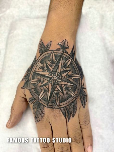 compass & flower tattoo design Compass Hand Tattoo Men, Compass Flower Tattoo, Compass Hand Tattoo, Hand Tattoo Men, Tattoo Training, Crazy Tattoos, Training Studio, Yin Yang Tattoos, Famous Tattoos