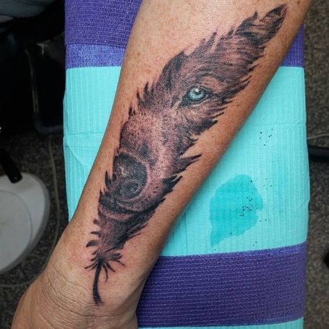 Feather With Wolf Tattoo, Feather And Wolf Tattoo, Wolf In Feather Tattoo, Feather Wolf Tattoo, Wolf Feather Tattoo, Indian Wolf Tattoo, Creative Tattoos For Men Inspiration, Feather Tattoo Men, Feather Tattoo Chest