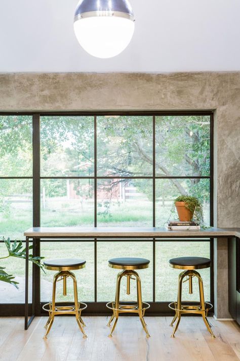 In one of their biggest stylistic challenges yet, our fearless Fixer Upper duo has a tall order to fill when a couple moving from Denver wants a country retreat — but a house with thoroughly modern style. See what happens when Joanna gives up shiplap (well, mostly) in favor of lots and lots of concrete. Bar In Front Of Window, Kitchen Bar Window, 60s Ranch, Window Counter, Kitchen Window Bar, Bar Window, Fixer Upper Kitchen, Ottawa River, Hgtv Fixer Upper