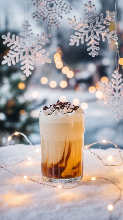 Glass of layered iced coffee topped with whipped cream and chocolate shavings, surrounded by snow, string lights, and hanging snowflakes. White Russian Drink, White Russian Recipe, Ice Cube Chocolate, White Russian Recipes, White Russian Cocktail, Creamy Cocktails, Winter Drink, Popular Cocktails, Coffee Liqueur