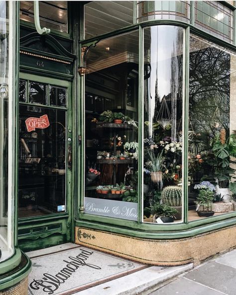 Bramble & Moss, Richmond Upon Thames, UK photo @francesmehardie Love vintage curved glass shop windows. And those tiles! Such a stunning flower… Storefront Aesthetic, Eric Butterworth, Store Front Windows, Window Display Retail, Richmond Upon Thames, Shop Facade, Storefront Design, Embossed Metal, Shop Fronts