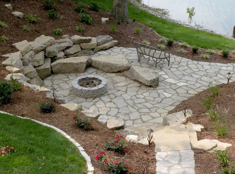 Fire pit with rocks for seating & bank containment Diy Stone Patio, Stone Patio Designs, Outdoor Fire Pit Seating, Fire Pit Seating Area, Fire Pit Landscaping, Stone Patio, Patio Projects, Fire Pit Seating, Garden Walkway