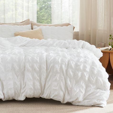 PRICES MAY VARY. Elegant Home Decor: This duvet cover set combines the exquisite seersucker craft with a checkered pattern, bringing a touch of sophisticated style to any sleeping space. Give the gift of elegant coziness to your loved ones, whether it’s for Mother’s Day, Valentine’s Day, Christmas, or just to show you care. Enhanced Sturdiness: This premium-quality and durable duvet cover set features neat stitching construction that ensures a stronger connection at the seams for enhanced sturdi White Bed Spreads, White Bed Comforters Ideas, White And Pink Bedding, Textured Duvet Cover, Textured Duvet, Pillow Case Mattress, Boho Duvet Cover, Boho Duvet, Coastal Room