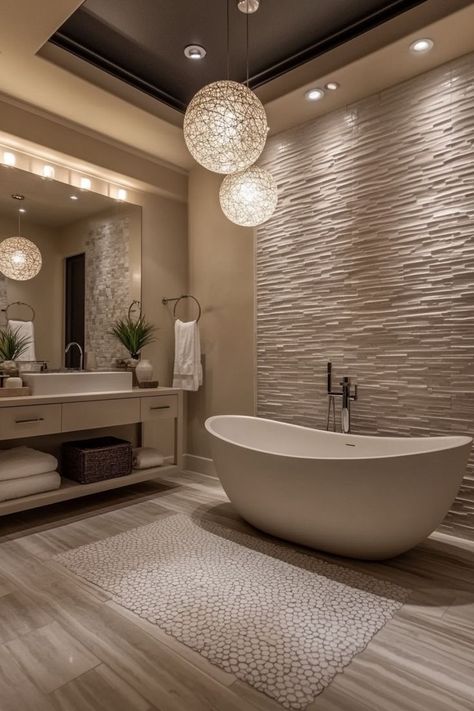 Create a spa-like retreat in your home with luxury bathroom decor. Opt for high-end materials like marble countertops, brass fixtures, and natural stone tiles. Incorporate freestanding tubs, rain showers, and heated floors for added comfort and indulgence. Use plush towels, elegant accessories, and soft, ambient lighting to enhance the lavish feel. A chandelier or statement lighting above the tub adds an extra touch of opulence. 🛁✨ Dark Grey Master Bath, Bathroom Feature Tile, Elegant Bathroom Ideas Luxury, Spa Bathroom Ideas Master Bath Decor, Large Bathroom Ideas, High End Bathroom Design Luxury, Bathrooms Luxury Modern, White Luxury Bathroom, Luxury Bathtubs