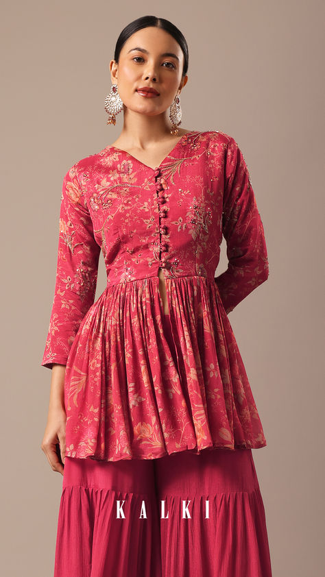 Bursting with vibrant hues and stunning prints, this fusion set is ideal for festive family gatherings. Decked with floral prints, the peplum top showcases potli show buttons. Designed with intricate cut dana, sequins, pearl and zari work, the two-piece set comes with a sharara. Plazo Outfits, Top And Sharara Set, Navratri Blouse, Top And Plazo, Pink Peplum Top, Indian Outfits Lehenga, Printed Peplum Top, Traditional Indian Outfits, Red Floral Print