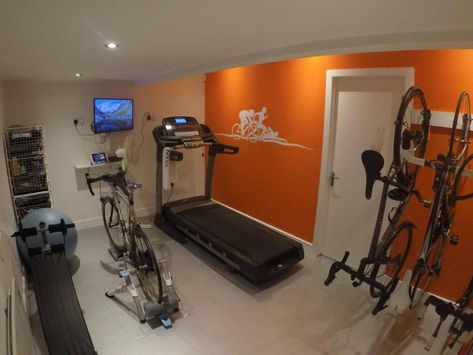 The pain cave essentials - Triathlon Magazine Canada Zwift Setup, Cycling Room, Zwift Cycling, Bike Cave, Gym Basement, Bicycle Garage, Garage Gym Ideas, Gym Designs, Gym Flooring Rubber