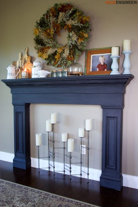 With the holidays coming up @rogue_engineer really wanted a mantel to doctorate and since they didn't have one they decided to build one. They built this faux fireplace surround out of one sheet of plywood, and it only cost about $75 to build. Now they have an awesome faux fireplace to decorate for the holidays and add some charm to the dining room. http://spr.ly/64968EqMe Navy Mantle Fireplace, Navy Fireplace Mantel, Blue Mantle Fireplace, Navy Mantle, Fireplace Artificial, Navy Fireplace, Fake Fireplace Mantel, Pallet Fireplace, Artificial Fireplace