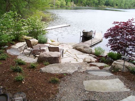 Shoreline Landscaping | Lakescaping | Grand Rapids, MI Lakeshore Landscaper Lakeside Landscaping, Lake House Backyard, Lakeside Patio, Lake Landscaping, Lake Dock, Fire Pit Landscaping, River Cabin, Lakeside Living, Lakefront Property