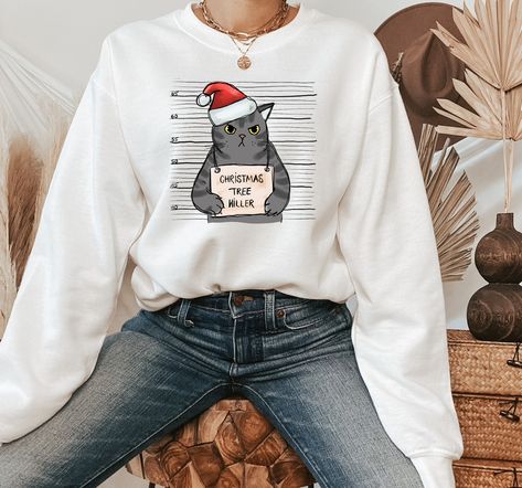 "Tree Killer Cat Sweatshirt, Funny Christmas Cat Sweater, Merry Catmas Hoodie, Gift For Cat Mom 🌺How To Order🌺 -Please, check and review all photos -Choose your t-shirt color and size -Choose your design/text color -Choose Your Quantity 🔴Please make sure you choose the right product. Unisex = T-Shirt Women's Cropped = Cropped Shirt Women Racerback Tank= Women Tank Top Sweatshirt = Without hood Crewneck Long Sleeve = Same as shirt material but long sleeve version Hodie = With hoodie and pocket Cat Christmas Sweater, Merry Catmas, Sassy Tee, Cat Sweater, Funny Christmas Sweaters, Design Text, Office Holiday, Cat Sweatshirt, Contest Winner