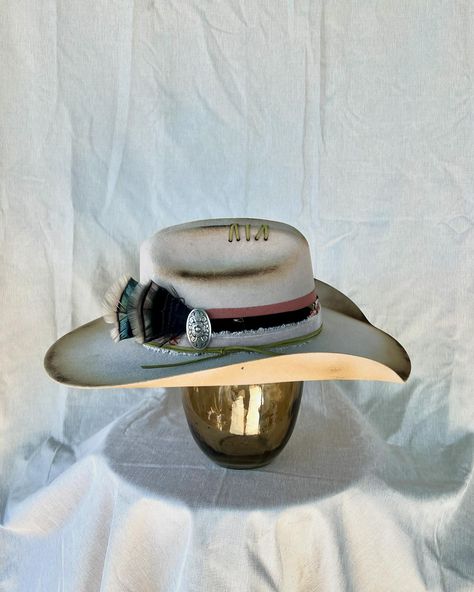 “Cow Belle” Custom burned and banded silver belly cowboy hat adorned with hand sewn details, matches, leather, silver concho, multiple fabrics and turkey feathers. Very good quality cashmere wool felt hat. One of a kind. Size: 7 $275 https://theroguecowpoke.etsy.com/listing/1807938475 Luxury Custom Fur Felt Cowboy Hat, Luxury Fur Felt Cowboy Hat For Western-themed Events, Western-themed Felt Hat With Feathers And Flat Brim, Western-themed Fedora Hat With Feathers, Western-style Brimmed Fur Felt Fedora, Turkey Feathers, Cashmere Wool, Felt Hat, Hats For Sale