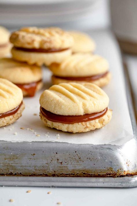 Caramel Sandwich Cookies with Sesame Seeds is a simple and quick 20-minute cookie recipe for eggless Christmas cookies. Zero cooking knowledge is needed for this recipe, because you really just combine everything and bake. #jernejkitchen #egglesscookies #caramel #sandwichcookies #caramelcookies Eggless Sandwich Cookies, Eggless Christmas Cookies, Caramel Sandwich Cookies, Best Eggs Benedict, Cooking Knowledge, The Best Eggs, Best Eggs, Eggless Cookies, Fancy Breakfast