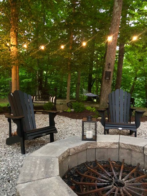 Sitting Areas Outside, House In Woods Landscaping, Backyard With Lots Of Trees, Landscape Around Fire Pit Area, Pebble Fire Pit Area, Pea Gravel Fire Pit Area, Cottage Fire Pit, Gravel Fire Pit Area, Bonfire Backyard