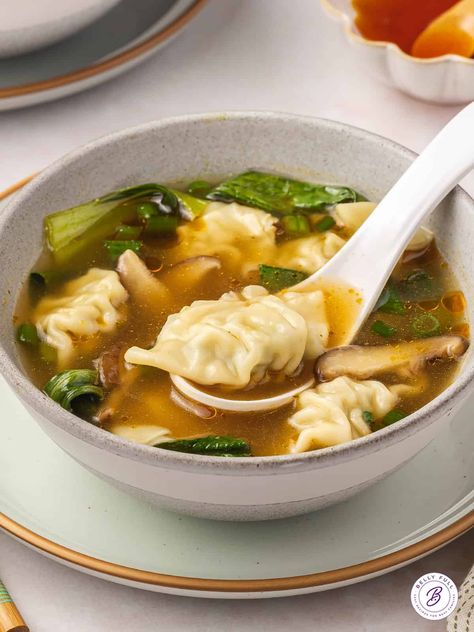 Made with mini frozen wontons and classic ingredients like bok choy and mushrooms, this Homemade Wonton Soup couldn't get any easier. It's ready in just 20 minutes with minimal prep and it's so tasty! Serve as a light meal on its own or as an appetizer to your favorite Chinese takeaway recipe. Chinese Dumpling Soup, Wonton Soup Broth, Easy Wonton Soup, Wonton Soup Recipe, Asian Soup Recipes, Dumpling Soup, Delicious Soups, Wonton Recipes, Hot And Sour Soup