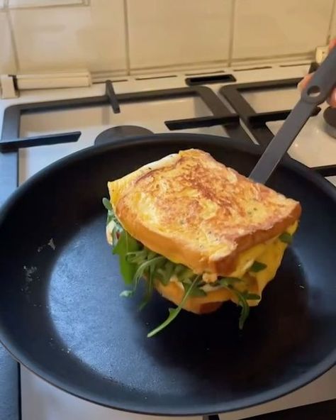 Food 🍏 on Instagram: "Viral 5 minute breakfast sandwich by @patiispage
Ingredients:
- 2 brioche bread toasts
- some butter
- 2 eggs
- 1 slice gouda cheese
- 1/2 avocado
- some cherry tomatoes
- handful arugula"