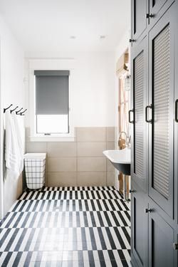 Industrial Bathroom + Striped floor tiles + Black and white + Farmhouse sink + bathroom storage | House of Jade Black And White Bathroom Floor, House Of Jade Interiors, Bathroom Lighting Design, Farmhouse Bathroom Design, Striped Tile, Mudroom Ideas, Suite Bathroom, Bathroom Farmhouse Style, Black And White Tiles