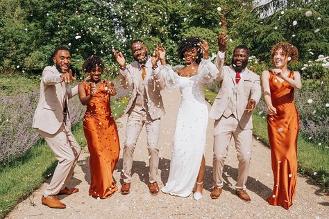 fun wedding party photography with confetti Satin Burnt Orange Bridesmaid Dress, Burnt Orange Bridal Party Groomsmen, Tan And Burnt Orange Wedding, Tan And Orange Wedding, Burnt Orange Weddings Black People, Burnt Orange And Beige Wedding, Burnt Orange And Tan Wedding, Orange And Beige Wedding, Orange Wedding Groomsmen