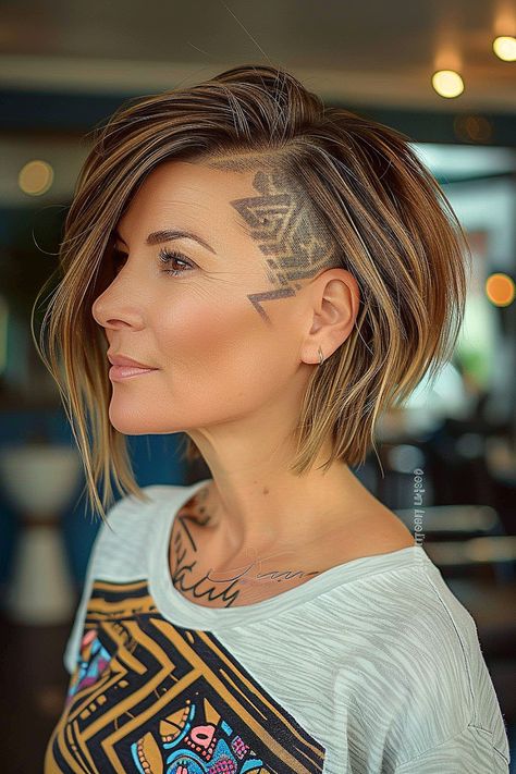 The Trendiest Layered Bob Haircuts of 2024 Sporty Haircuts For Women, Mid Length Undercut, Asymetrical Haircut Edgy Bob, Under Layer Hair Dye, Disconnected Layers, Bob With Undercut, Asymetrical Haircut, Lob Haircut Layered, Brunette Tones