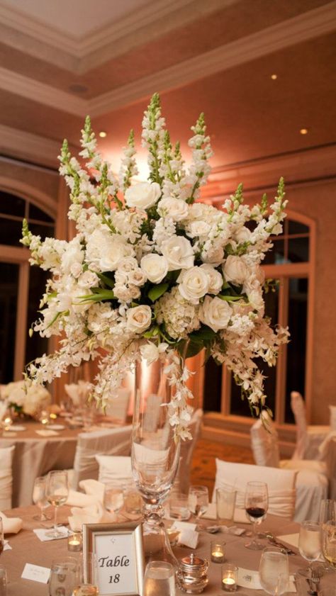 White Centerpiece Wedding Elegant, Floral And Candles Centerpieces, White Flowers And Greenery Wedding Reception, Oval Table Centerpieces, White And Gold Wedding Flowers, White Flower Centerpieces Wedding, Trumpet Vase Centerpiece, Glass Trumpet Vase, Round Wedding Tables