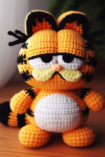 Nestled amongst the cozy skeins of vibrant yarn, the Garfield amigurumi brings the sass and charm of the world's favorite orange tabby cat to life. Crochet Garfield Hat, Crochet Garfield Pattern Free, Garfield Crochet Pattern, Garfield Crochet Pattern Free, Crochet Garfield, Orange Yarn Crochet Projects, Crochet Bird Patterns, Disney Crochet Patterns, Crochet Dog Patterns