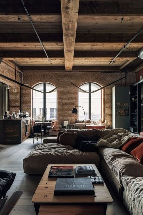 Bring the urban, industrial look into your home with exposed brick, metal accents, and oversized furniture. Opt for a large leather sofa, concrete or metal coffee table, and statement lighting like an Edison bulb chandelier. Finish with open shelving and abstract art for that loft-style feel. 🏙🛠 Industrial Homes, Edison Bulb Chandelier, Scandinavian Loft, Bulb Chandelier, Industrial Style Furniture, New York Loft, Oversized Furniture, Brick Loft, Appartement Design