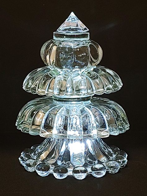 "This one-of-a-kind elegant Christmas tree is made using upcycled glass and crystal rescued from thrift stores and garage sales.  I hope your Classical Glass Christmas tree will become a part of your holiday mantel decoration or perhaps be part of a holiday dinner center piece. This tree is approximately 7\" tall, 5\" wide and is lit from below using the included multi-colored t-light which rotates from red to green to blue to purple.  An optional clear white t-light is available. The t-light is Glass Bowl Christmas Tree, Crystal Tree Diy, Christmas Tree Dyi, Glassware Garden Art, Glassware Crafts, Holiday Mantel, Crystal Christmas Tree, Elegant Christmas Trees, Crystal Christmas