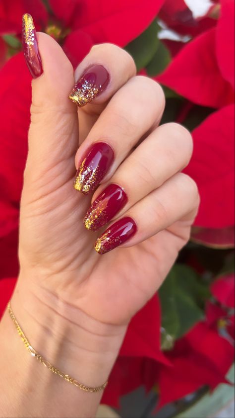 Classic red, ombre gold glitter, holiday manicure ideas Dark Red Nails With Gold Glitter, Red Nails Gold Glitter, Red With Gold Glitter Nails, Red And Gold Toe Nails, Red Nails Gold Tips, Red Gold Glitter Nails, Christmas Nails 2023 Red And Gold, Red And Gold Holiday Nails, Red And Gold Ombre Nails