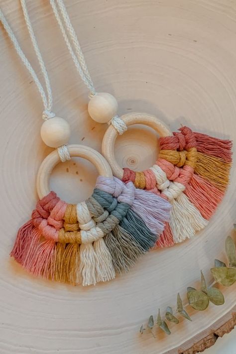 Accessorize your car with a colorful macrame diffuser! This car charm is available in two color options and can easily be slipped onto your rearview mirror. As a diffuser, this car charm will make your car smell great! Simply put a couple drops of essential oil onto the wood bead and enjoy! Wood Essential Oil Diffuser, Mini Macrame Car Diffuser Diy, Macrame Car Diffuser Diy Tutorial, Macrame Car Diffuser Diy, Macrame Car Diffuser, Macrame Diffuser, Macrame Car Charm, Beaded Car Charms, Colorful Macrame