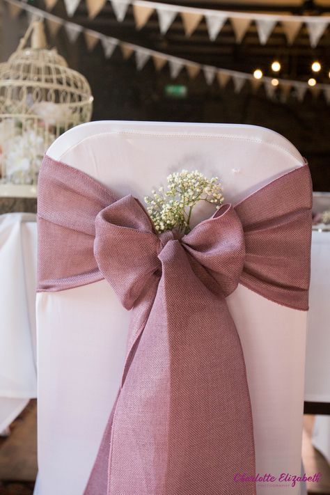 Dusky pink fabric bow at a rustic springtime wedding Bows For Wedding Decorations, Bows On Chairs Wedding, Bows On Chairs, Chair Bows Wedding, Spring Wedding Theme, Bow Chair, Hessian Wedding, Wedding Ceremony Decorations Indoor, Wedding In Spring