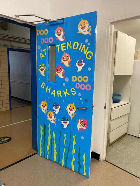 Bang shark themed classroom door decoration #classroom #doordecorations Baby Shark Classroom Theme, Shark Classroom Door, Summer Preschool Door Ideas, Infant Toddler Classroom, Preschool Door, Decoration Classroom, Ocean Classroom, Deco Disney, Ocean Theme Classroom