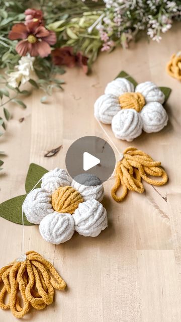 Katie | Crafter and Felt Enthusiast on Instagram: "I’m finally back to crafting and today I’m making this sweet yarn daisy garland! I used some left over small wool felt balls to start each of my yarn balls, but you could use a wood bead or some fabric. I love using things I already have on hand, so I don’t always have to buy everything new!   I haven’t done any new crafting for almost a week. A storm blew through West Virginia on Tuesday and we spent almost 2 days without any power. There were many things I missed not having electricity for, but one of them was my hot glue gun. A little silly I know, but crafting is definitely calming for me and having all four of my littles home with no power I could have used all the calming I could get😆 I will say having them home this week has been b Yarn Daisy, Daisy Garland, Wool Felt Balls, Yarn Balls, Yarn Flowers, Felt Balls, Wool Art, Wool Balls, Yarn Diy