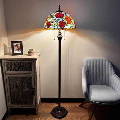 This traditional, incandescent-style lamp brightens any room. The unique stained-glass shade provides a warm ambiance perfect for cozy evenings. Enjoy the simplicity of a classic pull-chain design. Bloomsbury Market | Bloomsbury Market Aaniylah Tiffany Style Floor Lamp Stained Glass Rose Flowers LED Bulbs Included 64"H*16"W*16"D 64.0 H x 16.0 W x 16.0 D | 64" H X 16" W X 16" D | Wayfair Whimsical Floor Lamp, Tiffany Stained Glass Lamps, Big Floor Lamp, Vintage Standing Lamp, Tiffany Lamps Living Room Decor, Stainglass Lamps, Tall Lamps Bedroom, Grandmacore Decor, Long Floor Lamp