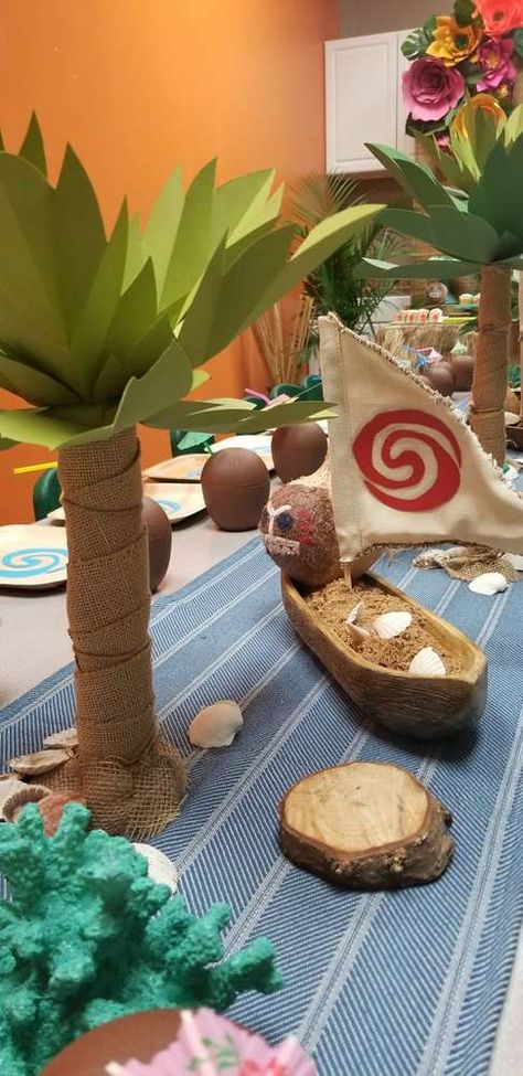 Moana Birthday Bash | CatchMyParty.com Moana Party Table Set Up, Moana Birthday Centerpieces, Moana Table Decorations, Maui Birthday Party For Boys, Moana Quince, Moana Centerpieces Ideas, Ocean Themed Birthday Party, Moana Centerpieces, Moana Birthday Decorations