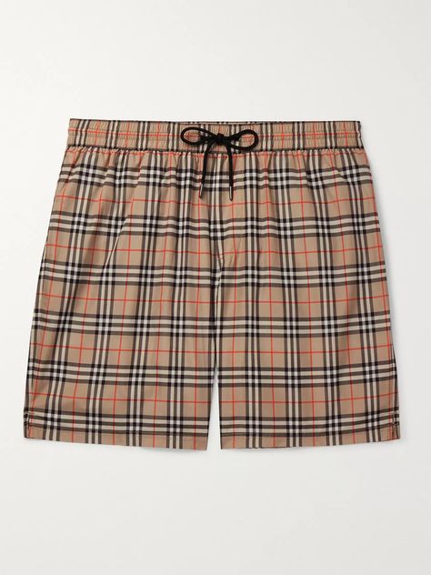 Burberry 's iconic check may be associated with rainy days and trench coats, but Mr Riccardo Tisci believes they'll look just as good on the beach, these swim shorts are a case in point. Patterned with the archival print, they have an elasticated drawstring waistband and longer length. Shown here with Burberry T-shirt, Valentino sandals, TOM FORD bracelet. Burberry Swim, Burberry Shorts, Valentino Sandals, Burberry T Shirt, Length Check, Burberry Vintage, British Outfits, Burberry Brit, Pique Polo Shirt