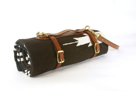 This leather blanket carrier is handsome and handy on a sunny afternoon. There are many functions for the straps to roll up anything you may want to bring camping, motorcycle riding, biking or to watch the sunset on a grassy hill.   Choose either natural leather or saddle tan, it also comes with a 60" x 30" saddle blanket for your adventures.  Handcrafted in Portland, Ore. with brass buckles and Herman Oak vegetable tanned leather. Blanket Carrier, Red Cloud, Saddle Blanket, Yoga Mat Bag, Mat Bag, Brass Buckle, Vegetable Tanned Leather, Yoga Mat, Leather Working