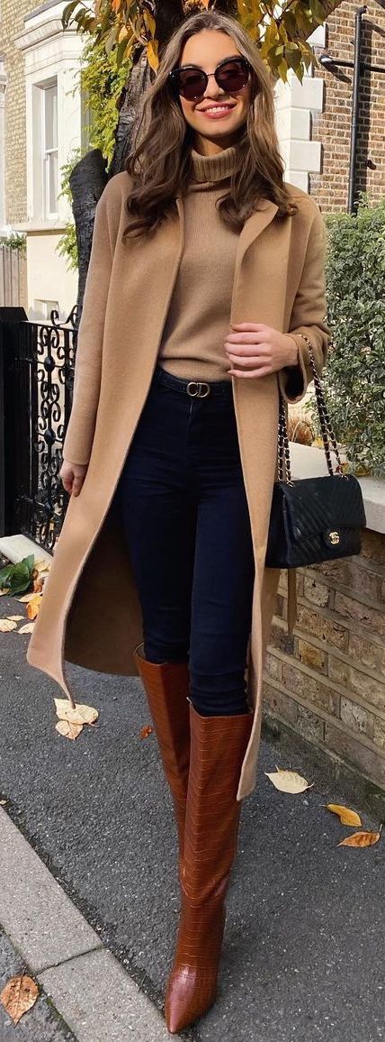 Monochrome top (shades of camel), tight blue jeans, Christian Dior belt, knee high boots Knee High Boots Outfit Fall, High Boots Outfit Fall, Brown Knee High Boots Outfit, Female Lawyer Fashion, Old Money Winter, Brown Boots Outfit, Fall Boots Outfit, Lawyer Fashion, Camel Coat