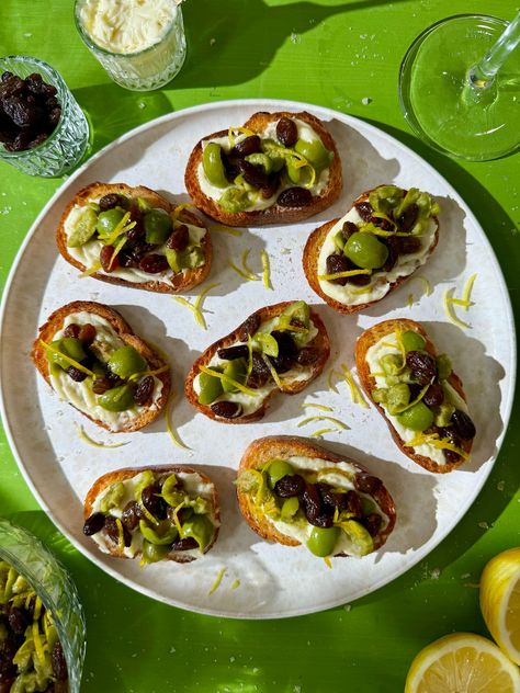 Drunken Raisin and Crushed Olive Crostini  Recipe Olive Crostini, Whipped Brie, Crostini Recipe, Crostini Appetizers, Appetizer Sandwiches, Sweet White Wine, California Raisins, Sliced Baguette, Summer Rolls