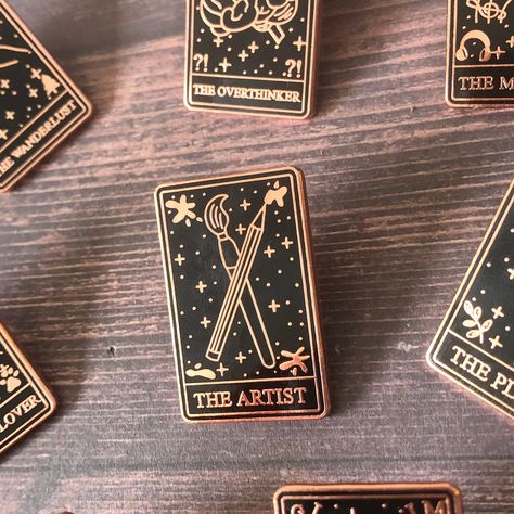 I see art in your future.. ✨   Are you an art lover? or do you know a artist? ) Than this pin is perfect as a way to show the world how much you or someone you know is art OBSESSED. Collect the full tarot card set! - Rose Gold Metal - Hard Enamel - Metal Clasp - Size: 31mm ------------------------------------------------------------- BUY ANY 3 PINS AND GET 10% OFF FREE SHIPPING (UK): OVER £15 | INTERNATIONAL: OVER £25 ------------------------------------------------------------ Please message me Tarot Card Set, Emprendimiento Ideas, Enamel Pin Collection, Stocking Filler Gifts, Pretty Pins, Pin Art, Rose Gold Metal, Metal Pins, Stocking Filler