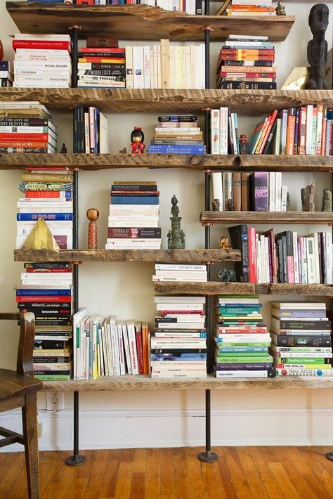 Pipe and Wood Shelving from: John & Fabien's Elemental Home — House Tour | Apartment Therapy Rustic Industrial Living Room, Rustic Bookshelves, Rustic Industrial Furniture, Lots Of Books, Rustic Bookshelf, Industrial Design Furniture, Industrial Livingroom, Regal Design, Diy Casa