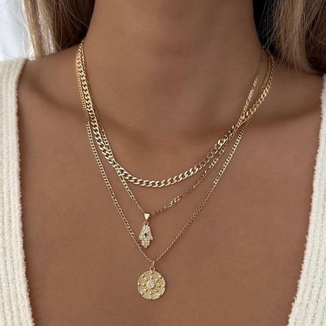 FINAL SALE. NO EXCHANGES OR RETURNS Gorgeous Hamsa necklace with encrusted cubic zirconia details. Perfect to wear alone or layer with other necklaces. 14k Gold Filled Chain 14k Gold Filled Charm Charm: 14.6mm x 7.9mm Chain length: 18" Chain Diameter: 2.5mm Lobster clasp closure Hypoallergenic Water resistant & tarnish free Nickel & lead free Additional discount codes do not apply to sale items Layering Gold Necklaces, Layered Necklaces Gold, Necklace With Charms, Stackable Necklaces, Hamsa Necklace, Stacked Necklaces, Pendant Necklace Gold, Jewelry Fashion Trends, Jewelry Essentials