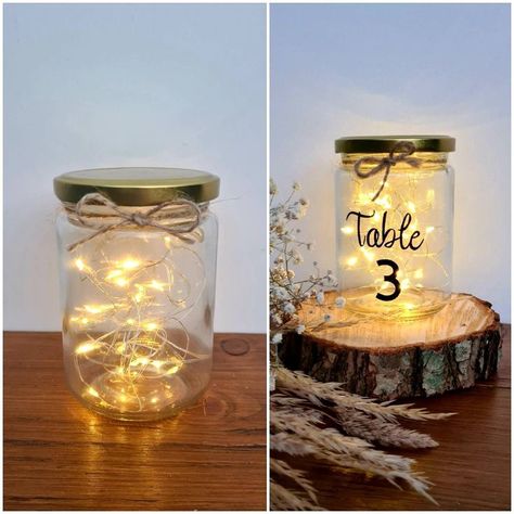 Jar Centerpiece Wedding, Barn Wedding Centerpieces, Fairy Lights In A Jar, Wedding Jars, Rustic Table Numbers, Fall Barn Wedding, Twine Bow, Lighted Centerpieces, Jar Centerpieces