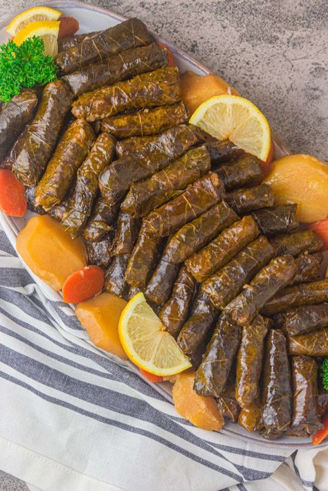 Stuffed Grape Leaves Recipe Stuffed Grape Leaves Recipe, Grape Leaves Recipe, Stuffed Vine Leaves, Stuffed Grape Leaves, Pomegranate Molasses, Seasoned Rice, Cabbage Rolls, Ramadan Recipes, Sliced Potatoes