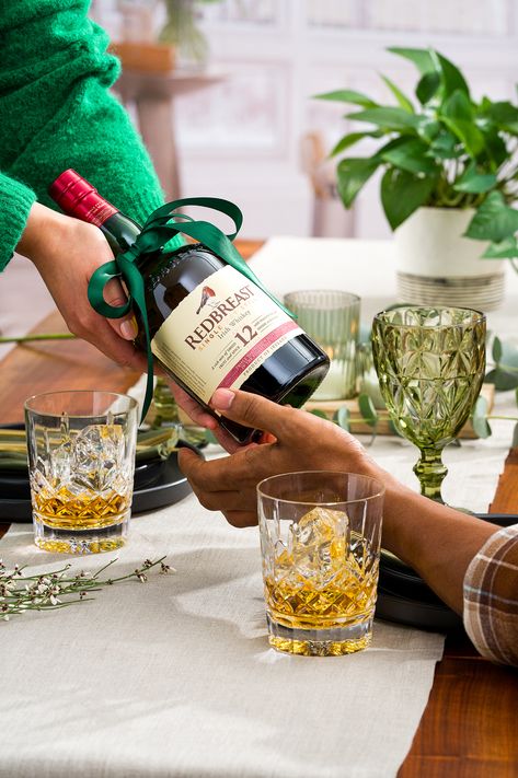 Redbreast is the quintessential Single Pot Still Irish Whiskey – beloved year round, but particularly on St. Patrick’s Day. In celebration of the most Irish day of the year, a suite of assets was created to depict at-home festivities. For this studio shoot, we were inspired by shades of green and subtle nods to the holiday, such as green glassware, table decor and florals. This series features creative ideas and inspiration for tasteful and elevated cocktail and product photography. Holiday Beverage Photography, Christmas Alcohol Photography, Holiday Gift Photography, Holiday Wine Photography, New Years Product Photography, Holiday Product Shoot, New Year Product Photography, Festive Product Photography, Gifting Photography