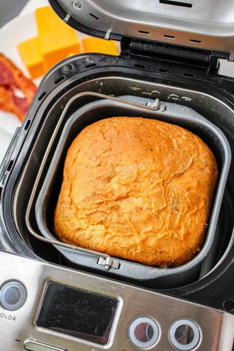 This easy-to-make bread machine cheese bread recipe is made with cheddar cheese and crisp bacon swirls in the dough before baking. Bread maker recipes take all the work out of making fresh baked bread, and this cheddar bacon bread version is no exception. Perfect for soup, sandwiches, and toasting! Bread Machine Recipes Bacon And Cheese, Bread Machine Recipes Fall, Cheese Bread For Bread Machine, Bread Machine Recipes Cheese, Cheese Buns Bread Machine, Bread Recipes In Bread Machine, Bread Maker Sweet Bread, Thanksgiving Bread Machine Recipes, Cheese Bread In Bread Machine