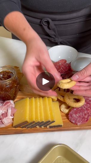 14K views · 154 reactions | Build your best charcuterie yet with @belle_english's board tips. Explore our Inspiring Boards page and shop online here: cur.lt/5wzxhabzl. | By Williams Sonoma | Building a charcuterie board is
an artistic expression. You really can't do it wrong. I
like a soft cheese like a brie, a grease, stinky funky cheese.
Don't be afraid to go outside the board though. Maybe we'll
put some of this next to the blue. Prosciutto is one of my
favorite things. Dry Italian salami. Next is all the breads
and crackers, the vessels. These are some pitted castor
bachano olives. Kind of just throw them on and see what they
do. Um figs are like my favorite fruit of all time. I
always have an emergency bundle of rosemary. And that is how
you make ultimate charcuterie board. Ultimate Charcuterie Board, Italian Salami, Cheese Wedge, A Charcuterie Board, Grazing Table, Brie Cheese, Grazing Tables, Soft Cheese, Artistic Expression