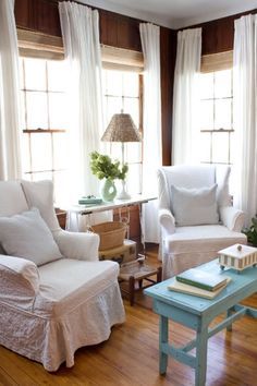 Long, flowing drapes and bright, white chairs give this paneled room a breezy, beachy feel. The best part? This fix doesn't involve any messy paint, and adds light texture to a space. See more at The Lettered Cottage. Deco Champetre, White Chair, White Curtains, Cool Ideas, Cottage Living, Home Fashion, Cottage Decor, The Window, Wood Paneling